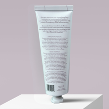 Load image into Gallery viewer, Back of FemmeSense Balm tube with text on a light purple background
